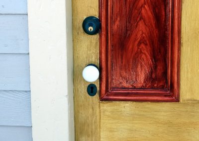 beautiful Cosmo door with red inlays and a white door knob